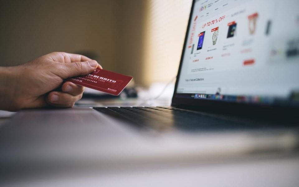 A shopper paying by card for an order on an online store