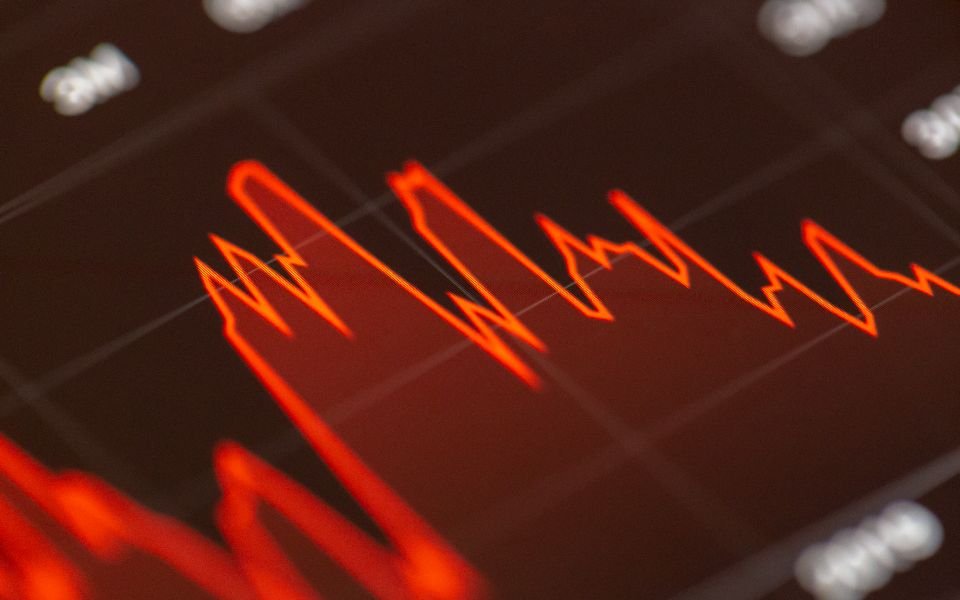 A glowing market chart on a trading screen
