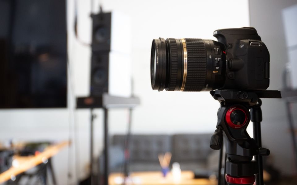 A camera on a tripod in a production studio