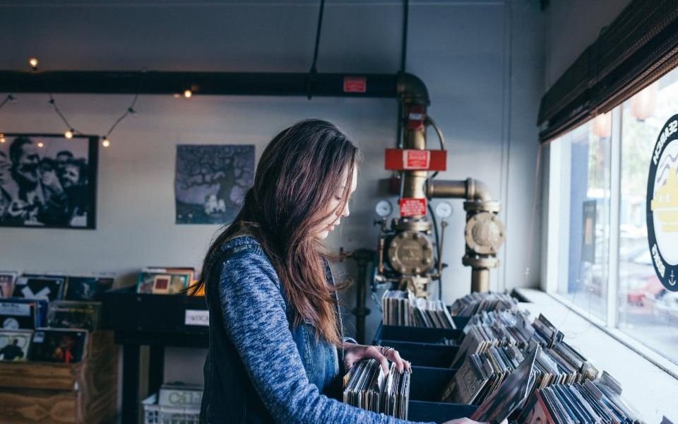 A shopper browsing records in an independent store