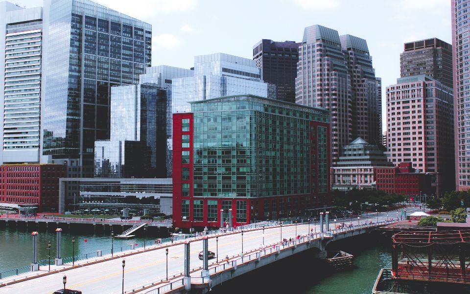 City towers beside a waterfront, home to businesses in many industries