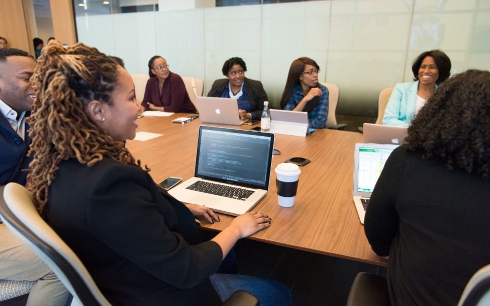 A client team meeting a software development company around a conference table